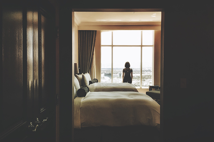 A woman standing in a hotel room