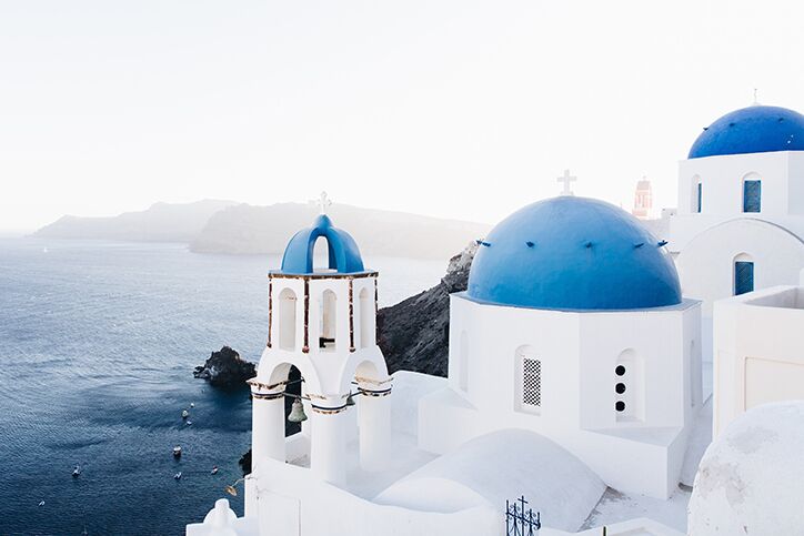 White buildings with blue roofs in Santorini Greece