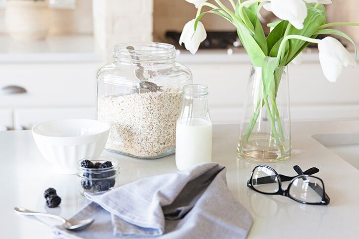 Ingredients on a kitchen counter next to a pair of eyeglasses