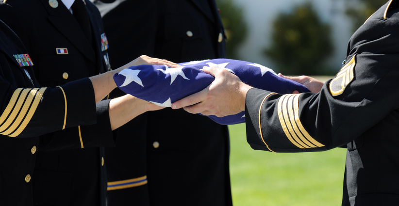 Flag is prepared that draped the casket of one of America's fallen heroes.