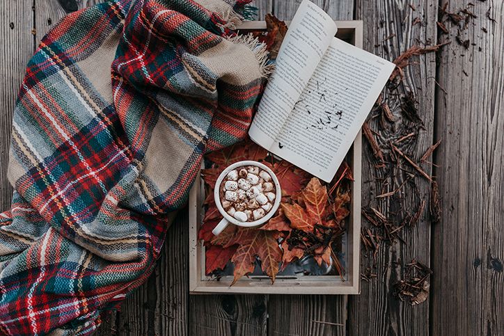 fall leaves, scarf, book, and hot chocolate