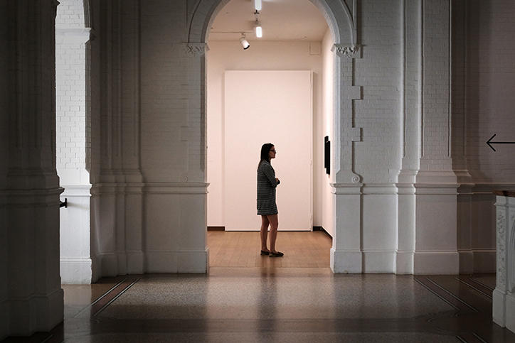 woman standing in gallery
