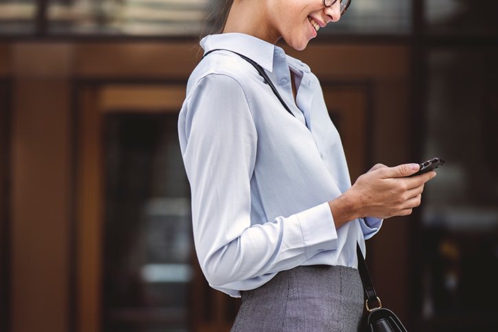 businesswoman looking at phone