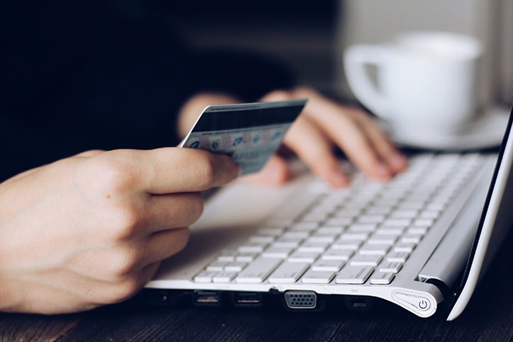 A person paying online with a credit card