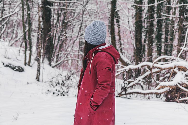 woman wearing red winter coat