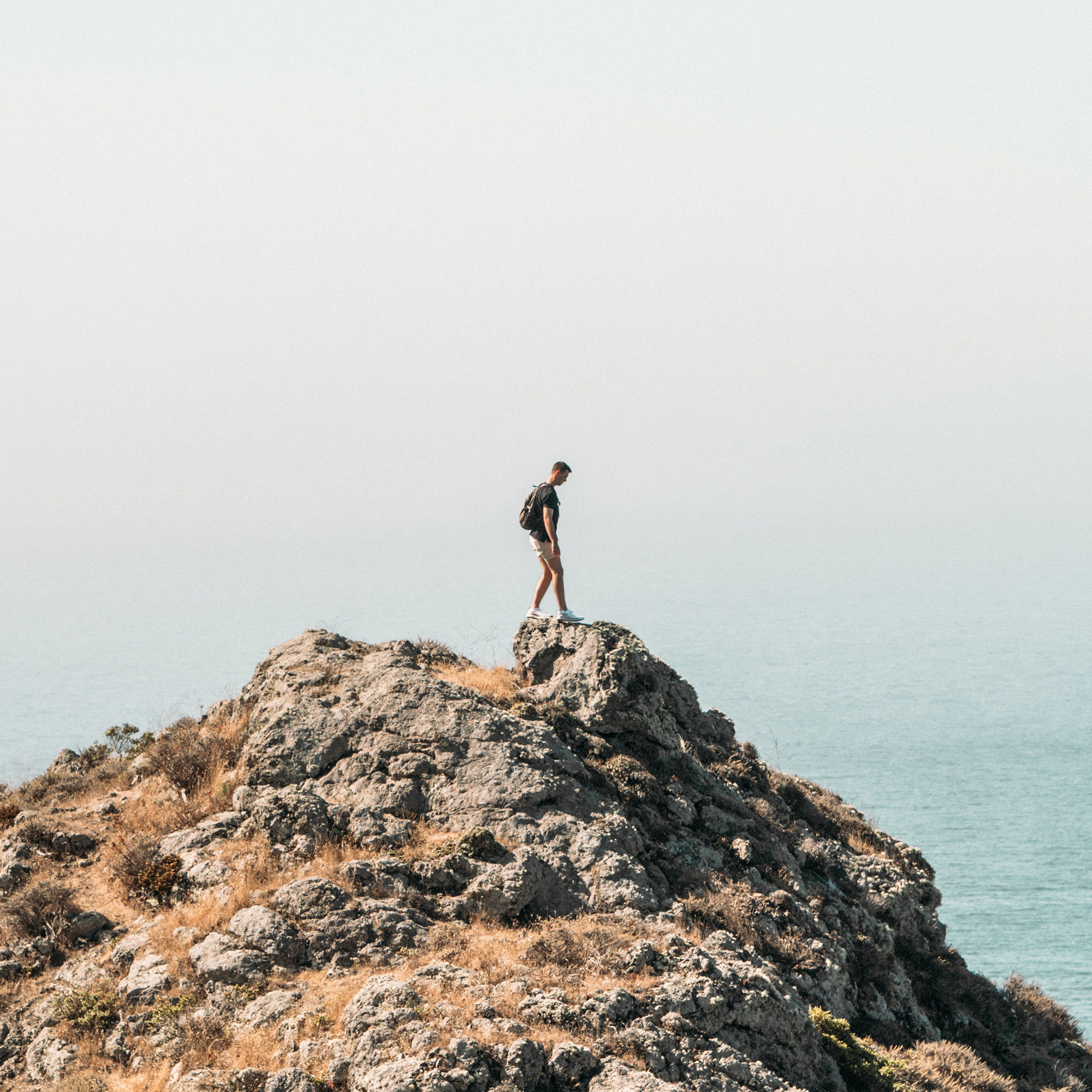 A man standing on a cliff