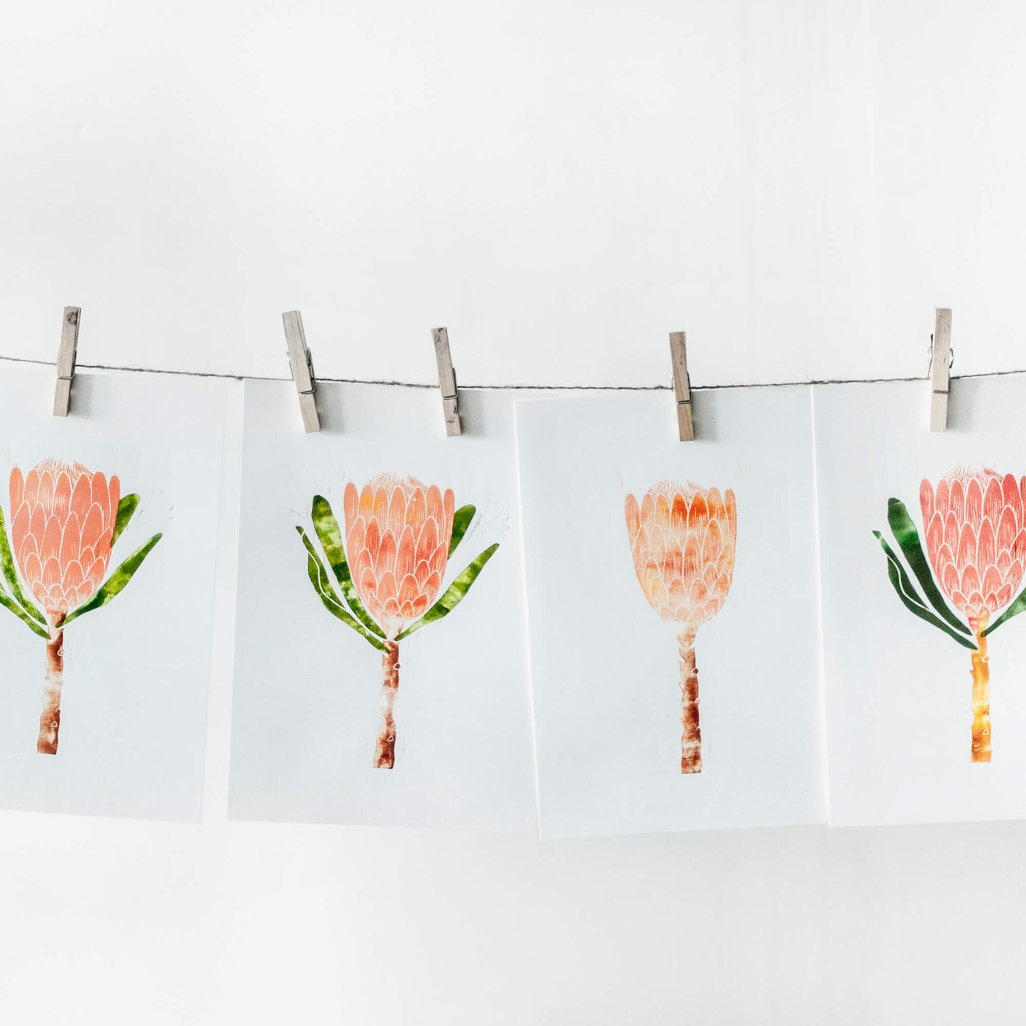 photos on a string with clothespins